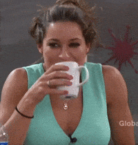 Celebrity gif. Nutritionist Elissa Taylor holds a white coffee mug to her mouth, liquid spewing out as she laughs.