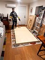 The assembled table was HARD to get into my basement. I briefly considered removing a window as if I was bringing in a piano. Here pictured is my very patient boyfriend after we found a way to get it into the house.