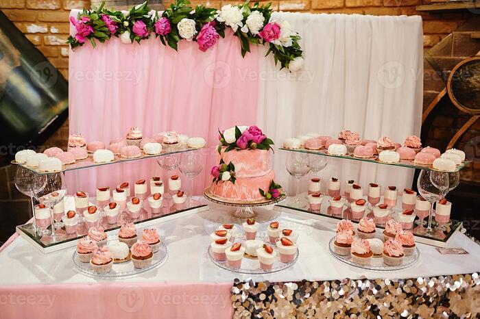 candy-bar-pink-wedding-cakes-decorated-by-flowers-standing-at-a-festive-table-with-deserts-strawberry-tartlet-and-cupcakes-wedding-concept-photo